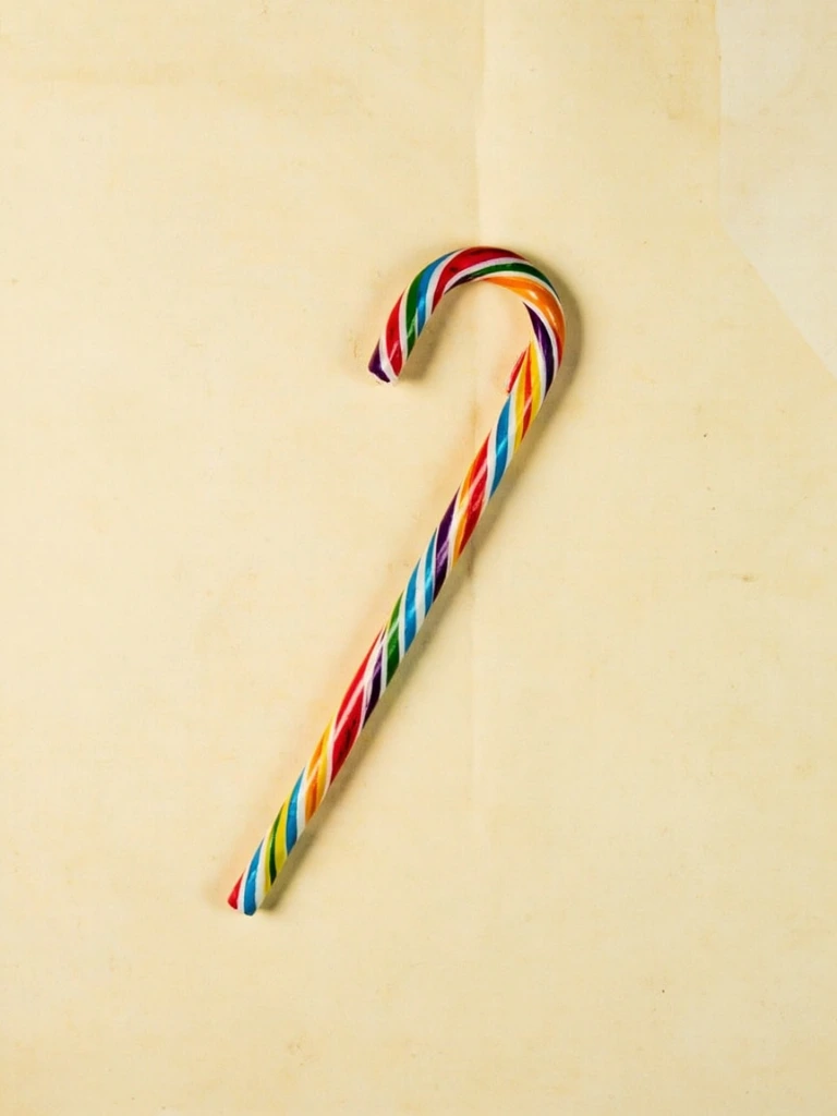 Rainbow-striped candy cane with four vivid colors
